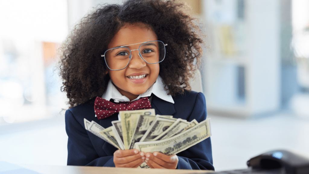 little girl holding cash in her hands